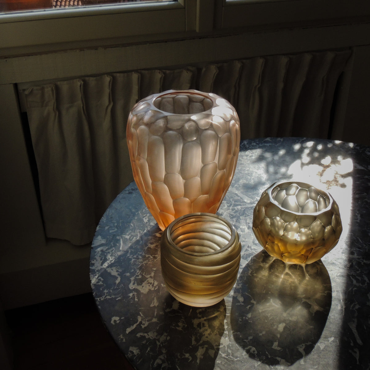 Hand-blown and engraved Murano glass vases, side view